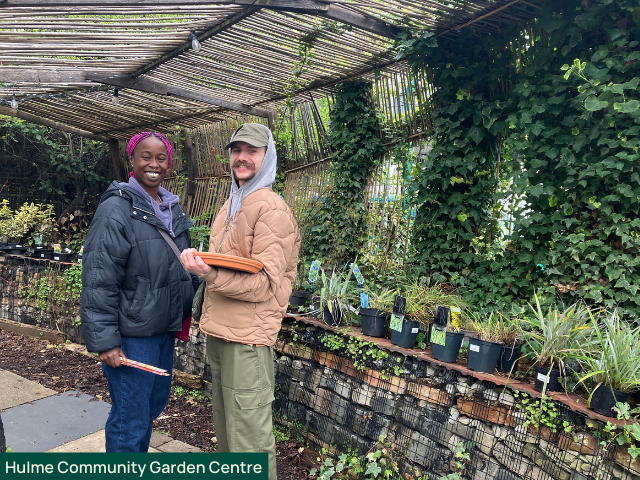Two people at Hulme Community Garden Centre