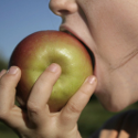Person eating apple