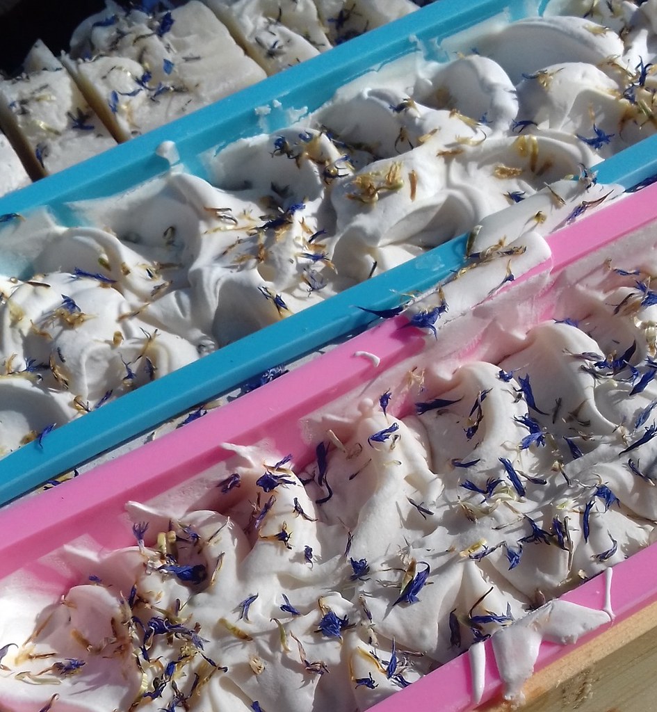 Soaps curing with flowers on top