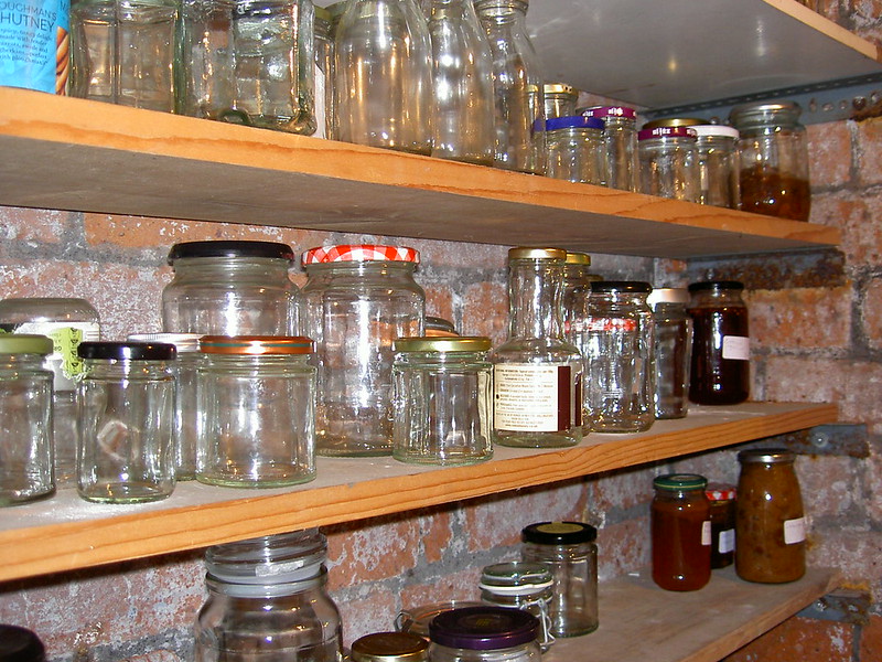Jars with lids on larder shelf