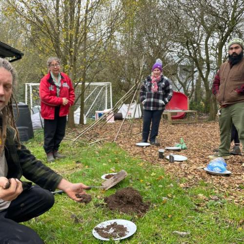 Stephan showing students how to analyse soil