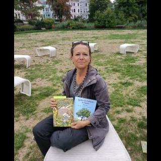 Anna with her recent book and favorite book about orchards.
