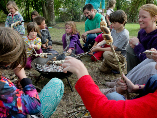 children round campfire