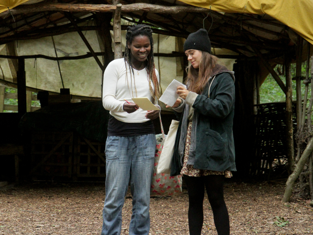 Two women sharing notes 